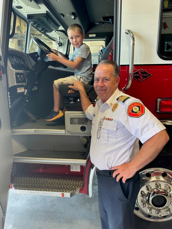 Luke and Fire Chief Rick Chesebrough.