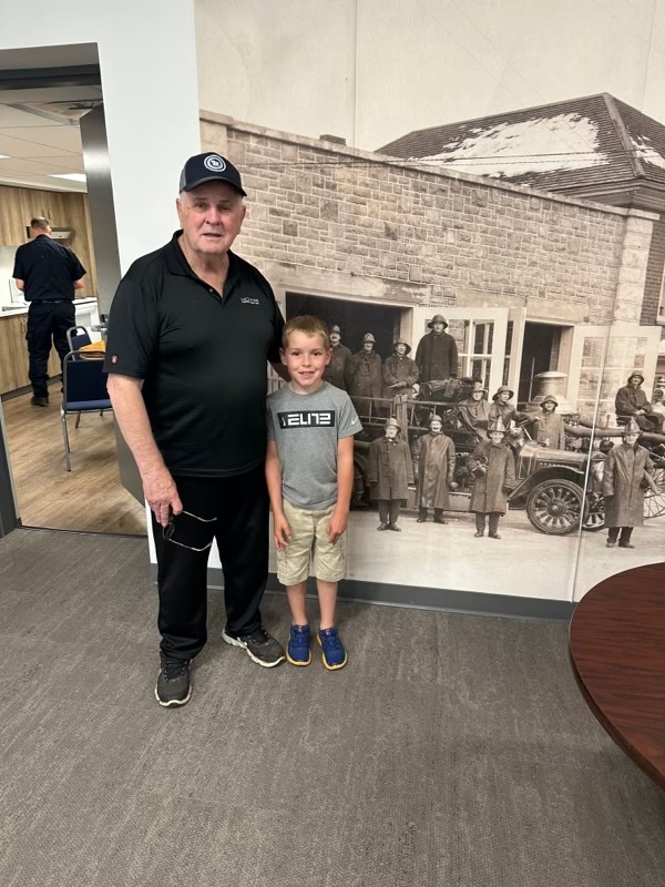 Claude Matte and grandson Luke at Smiths Falls fire station.