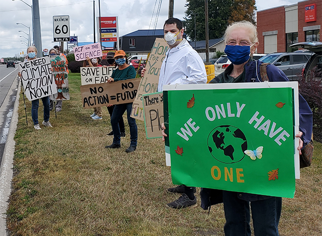 Seniors for Climate with signs say 
