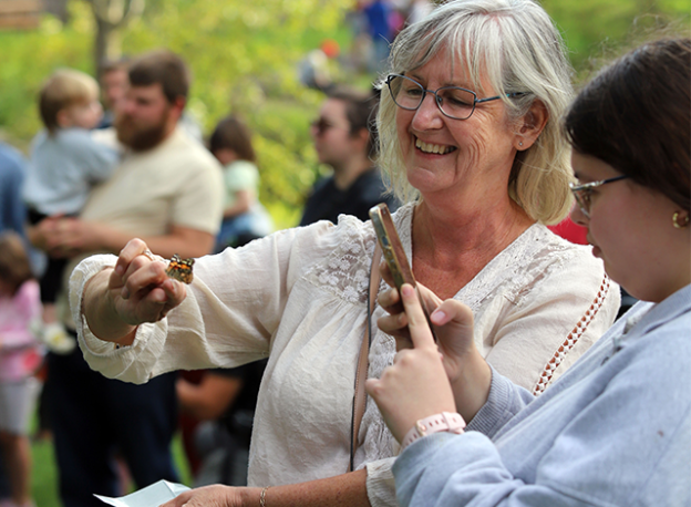 Heather Griffith releases a butterfly during an event